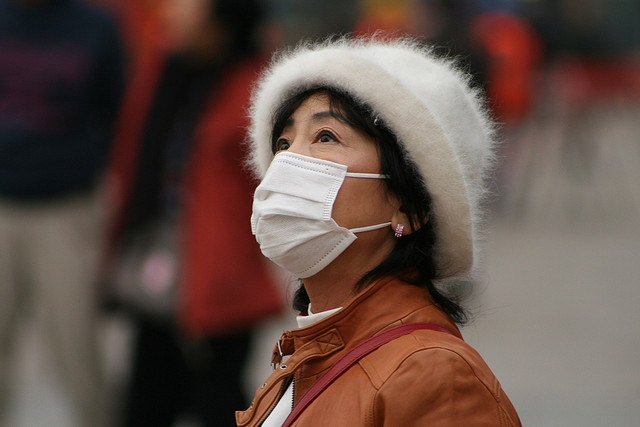 Chinese in mask by NicolÃ² Lazzati on Flickr